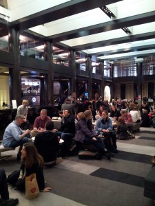 Attendees mingling in hotel lobby